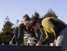 Graduate students Juliette and Andrea working on SoRMS instruments on the roof