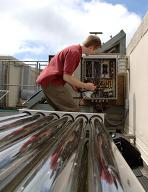 A student works with solar collector instrumentation